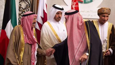 King Salman bin Abdulaziz of Saudi Arabia shakes hands with Kuwaiti Emir Sheikh Sabah Al-Ahmad Al-Jaber Al-Sabah, as Qatar's Prime Minister Abdullah bin Nasser bin Khalifa al-Thani and Omani Deputy Prime Minister Fahd bin Mahmud al-Said look on. AFP