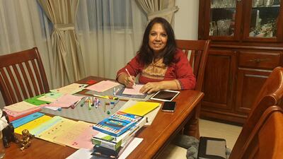 A volunteer for Letters of Love personalises the messages sent in from people around the world. Courtesy Letters of Love