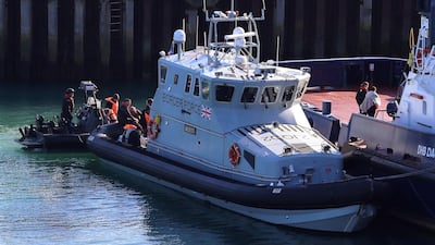 A Border Force boat returns to Dover, Kent, England carrying people thought to be migrants after they were picked-up crossing the English Channel on Friday, Febuary 7, 2020. PA via AP