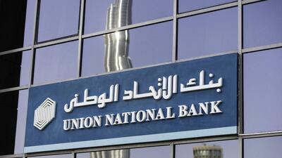 A reflection of the Burj Khalifa skyscraper sits in the windows of a Union National Bank bank branch in Dubai. UNB shares climbed second day on Wednesday: Bloomberg