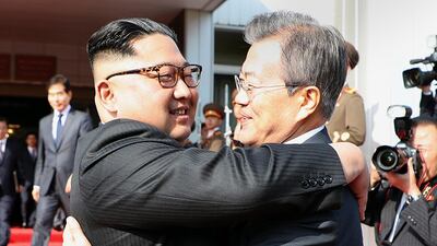 South Korean President Moon Jae-In and North Korean leader Kim Jong-Un hugging each other after their second summit in the North Korean side of the demilitarised zone. Blue House handout / EPA