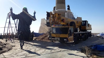 Workers prepare to install a statue of Jesus on Mount Sednaya, Syria. Samir El Gadban / AP