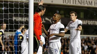 Tottenham Hotspur's Jermain Defoe, centre, and Gareth Bale, right, argue with the referee during their loss to PAOK Salonika. That result means the English side are facing elimination from the Europa League.