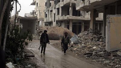 Rebel fighters in Jobar, Syria. Amer Almohibany / AFP