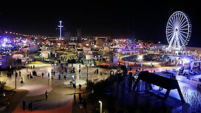 People spend the evening at the Diriyah Oasis amusement park on the outskirts of Riyadh. Saudi Arabia is pushing to diversify its economy away from oil. AP