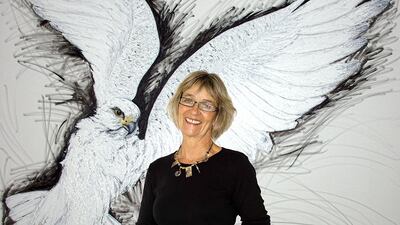 The British artist Christine Allison stands against her painting White Gyr Falcon. Courtesy Christinen Allison