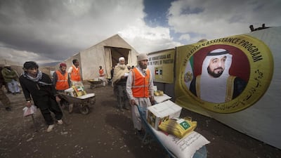 Food baskets are distributed to families in Pakistan earlier this year as part of the UAE Project to Assist Pakistan. Having Emiratis spend time abroad volunteering their services could help their professional development. (Photo: WAM)