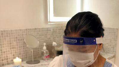 Therapists now wear face visors, as well as face masks.