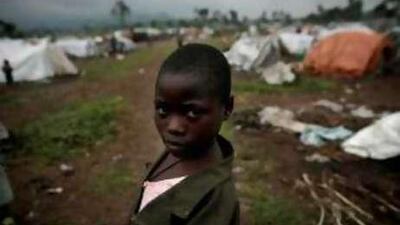 Blandine, 9, was separated from her parents in October during fighting in her village of Rumangado. She is now living with a family that offered to look after her in the Kibati camp for internally displaced people. Below, Nyirambabazi Mbonabucha, who lost her son Turikumwe.