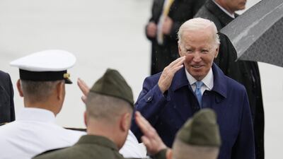 US President Joe Biden salutes troops as he arrives at the Marine Corps Air Station Iwakuni on his way to the G7 leaders' summit in Hiroshima. EPA