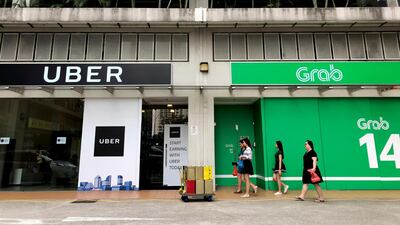 Singapore’s competition watchdog said it suspects competition has been infringed by Uber’s deal to sell its operations in Southeast Asia to rival ride-hailing firm Grabl. (AP / Wong Maye-E