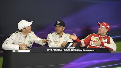 Nico Rosberg, left, exchanges a few words with Sebastian Vettel, right, following the Australian Grand Prix on March 15. Andy Brownbill / AP Photo