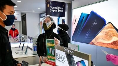 Global smartphone manufacturers were severely impacted by the temporary closures of factories in China and the reduced consumer spending in the first three months of this year. AFP