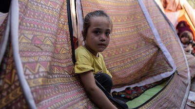 At Shar-e-Naw park, one of the city centre’s main recreational areas, children watch as their parents beg for food. Stefanie Glinski / The National