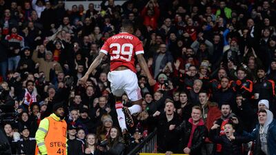 English striker Marcus Rashford celebrates scoring his team's second goal. AFP