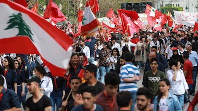 Supporters of the Lebanese Communist party march in Beirut on May 1, 2019 to mark Labour Day and protest against corruption and misuse of public funds. AFP