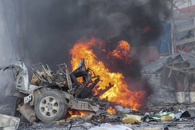 A vehicle burns after a car bomb exploded on November 1, 2015, in front of the Sahafi Hotel in Mogadishu. EPA