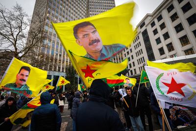 Kurds with pictures of Kurdistan Workers' Party leader Abdullah Ocalan during a protest called by the Democratic Council of Kurdistan Communities in Belgium, in Brussels, on December 11. EPA