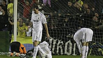 Real's players look distraught after conceding to Alcorcon at the Santo Domingo stadium in Madrid.