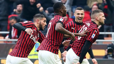 Ante Rebic, right, begins his celebratin after scoring the winning goal against Udinese. EPA