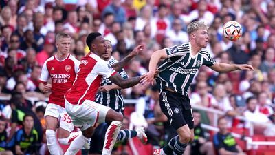 Manchester United's Rasmus Hojlund and Arsenal's Gabriel battle for the ball. PA