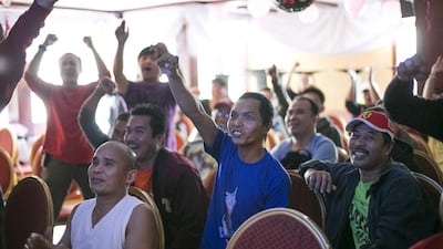 Filipino fight fans in Abu Dhabi celebrate Manny Pacquiao‘s unanimous points win over challenger Chris Algieri. Marzooqi / The National