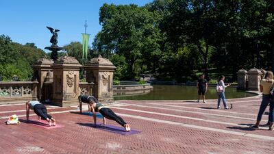 People do yoga near the flooded Bethesda Fountain in Central Park after a night of extremely heavy rain caused by Hurricane Ida on September 2, 2021, in New York City. AFP