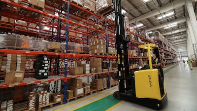Staff moving supplies at the UPS warehouse in Jafza in Dubai.
