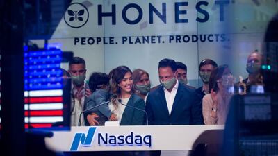 Jessica Alba, co-founder and chief creative officer of Honest Company, left, and chief executive Nick Vlahos ring the opening bell at the Nasdaq exchange in New York on Wednesday to celebrate the company's initial public offering. Bloomberg
