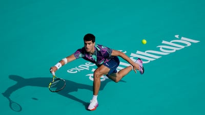 Carlos Alcaraz returns the ball to Casper Ruud. AP