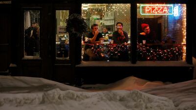 Diners sit in the front window of Nicoles South End pizzeria in Boston, Massachusetts. Brian Snyder / Reuters