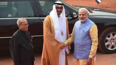 Sheikh Mohammed bin Zayed, Crown Prince of Abu Dhabi and Deputy Supreme Commander of the Armed Forces, is greeted by Indian prime minister Narendra Modi and Indian president Pranab Mukherjee before a ceremonial reception at the Indian President’s house in New Delhi on Wednesday. Money Sharma / AFP