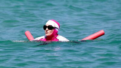 A woman in Saint Tropez swims in a burqini – now banned from the beaches of a handful of French towns (Photo by Peter Slane/Papixs via Getty Images)