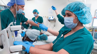 Doctors at Corniche Hospital in Abu Dhabi perform endometriosis laparoscopic surgery. All photos: Victor Besa / The National