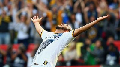 Landon Donovan celebrates after the LA Galaxy's 2-1 win over the New England Revolution in the MLS Cup on Sunday. Victor Decolongon / Getty Images / AFP / December 7, 2014