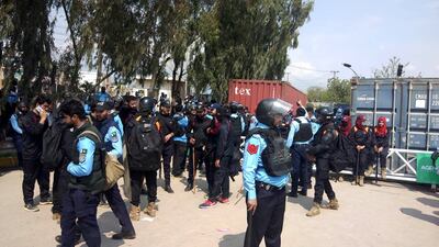 Security officials stand guard in Islamabad on Saturday as former prime minister Imran Khan was to appear in court following a complaint filed by the Election Commission of Pakistan that he allegedly concealed gifts in asset declarations. EPA