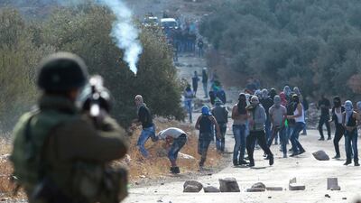 Palestinian protesters and Israeli security forces clash in the West Bank village of Tuqua, southeast of Bethlehem, on October 8. AFP Photo