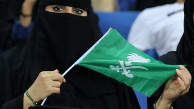 A Saudi Arabian waves a flag. EPA