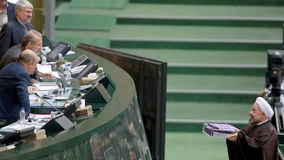 Hassan Rouhani presents the proposed annual budget to Parliament speaker Ali Larijani AFP PHOTO/HO/IRANIAN PRESIDENCY WEBSITE