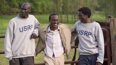 Ger Duany, from left, Arnold Oceng and Emmanuel Jal appear in a scene from The Good Lie. AP Photo/Warner Bros. Pictures, Bob Mahoney