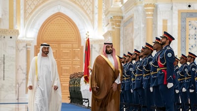 Sheikh Mohamed bin Zayed and Prince Mohamed bin Salman inspect the UAE Honor Guard during a state visit reception at Qasr Al Watan.
