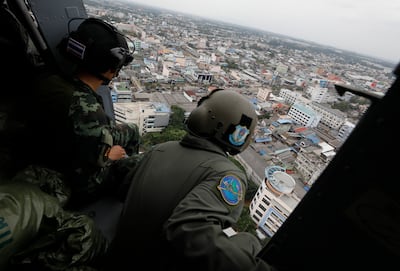 Thai military rescuers look for stranded residents while distributing relief packages in Hat Yai, southern Thailand. EPA
