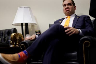 US Representative George Santos chats with his staff before attending the State of the Union address on Capitol Hill in Washington. Reuters