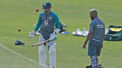 Pakistan's captain Babar Azam, left, prepares to bat next to teammate Sajid Khan. AFP