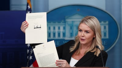 White House press secretary Karoline Leavitt shows a tariffs letter from US President Donald Trump to South Korean President Lee Jae-myung. Reuters