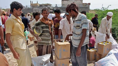 Yemenis displaced from the port city of Hodeidah receive humanitarian aid donated by the World Food Programme (WFP) in the northern province of Hajjah. AFP
