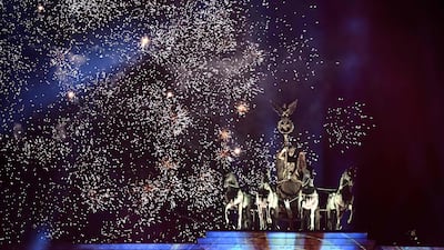 Fireworks explode over Berlin's Brandenburg Gate during a New Year's light and music show before midnight on December 31, 2022. AFP
