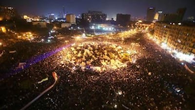 Protesters in Cairo converged in their thousands on Tahrir Square where a sit-in began last week after the president signed a decree making his decisions immune from legal challenge.