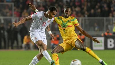 Tunisia defender Ayman Ben Mohamed under pressure from Mali's Boubakar 'Kiki' Kouyate. AFP