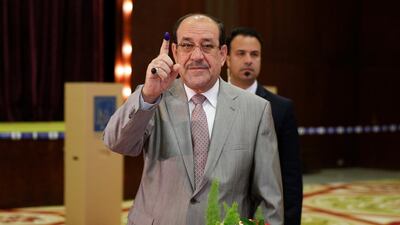 Iraqi Vice President and former Prime Minister Nouri Al Maliki shows his ink-stained finger after casting his vote at a polling station during the parliamentary election in Baghdad, Iraq May 12, 2018. Ahmed Jadallah / Reuters